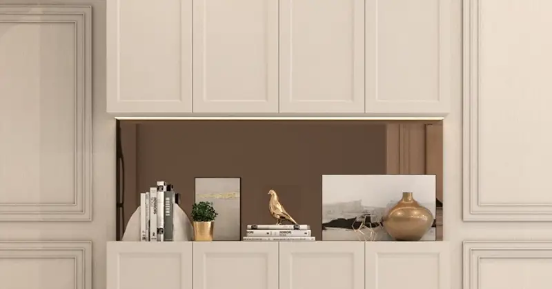 The classic panels in this foyer’s wall add dimension and elegance to the home design.
