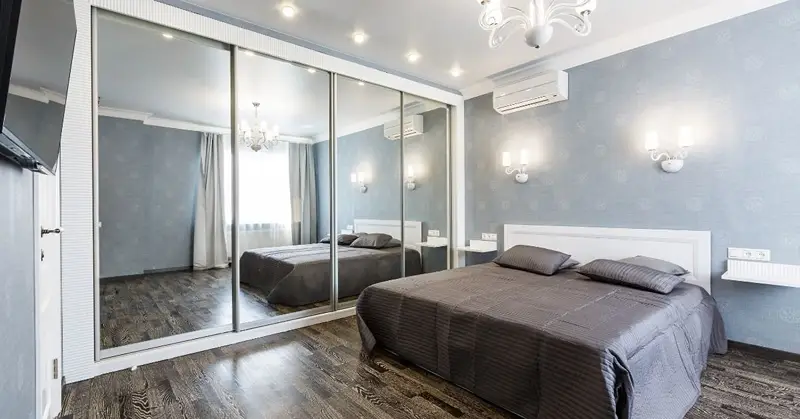 Mirrors create an illusion of depth. Much like a light-colored room, mirrors reflect light and spaces across a room which makes the vicinity look bigger.
